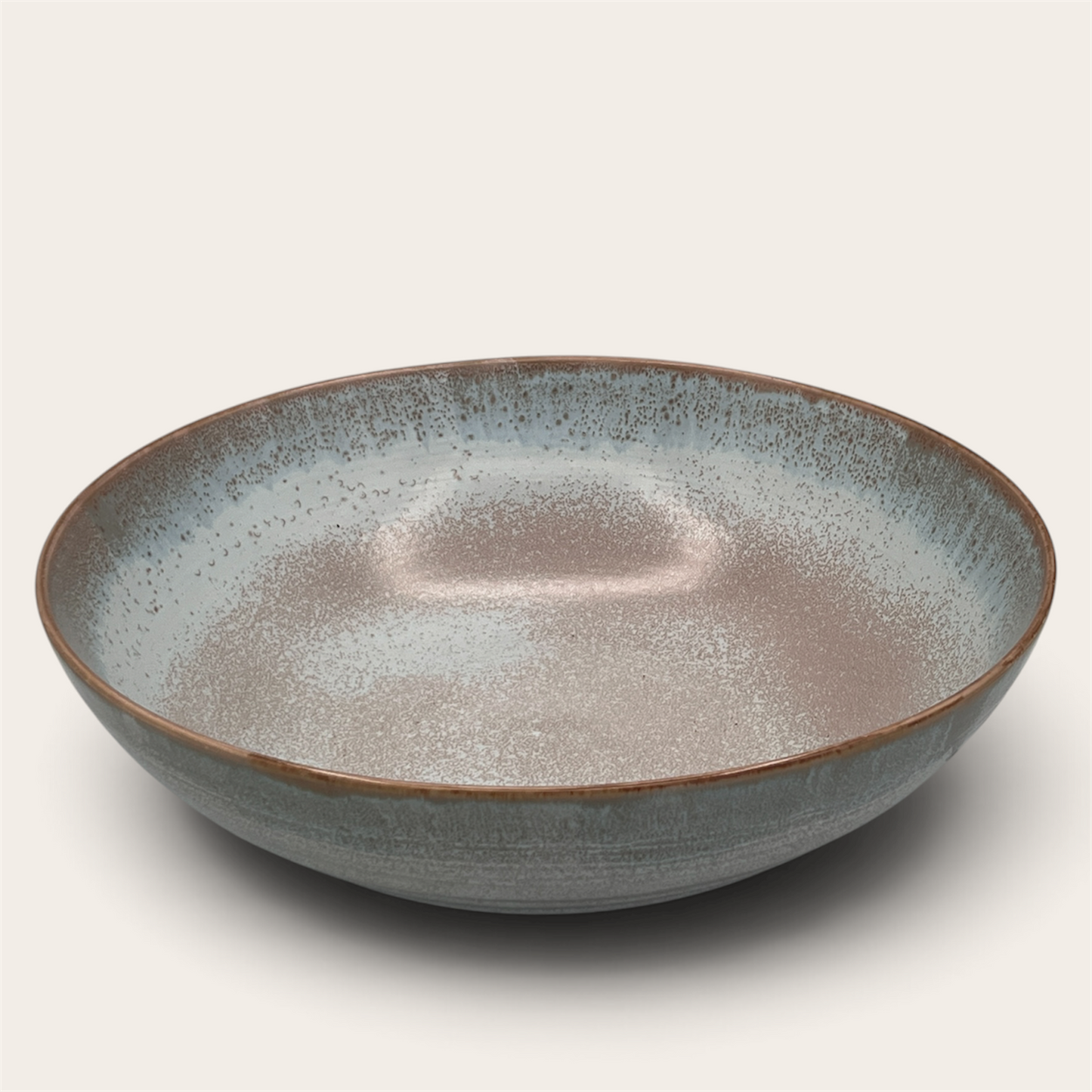 Reactive glaze stoneware serving bowl, top-down view showing interior glaze