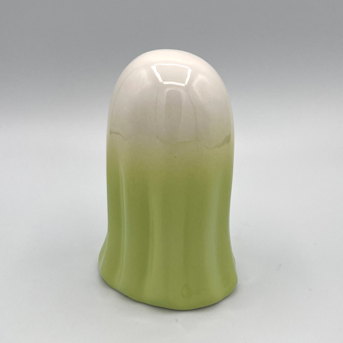 Green ghost figurine back view