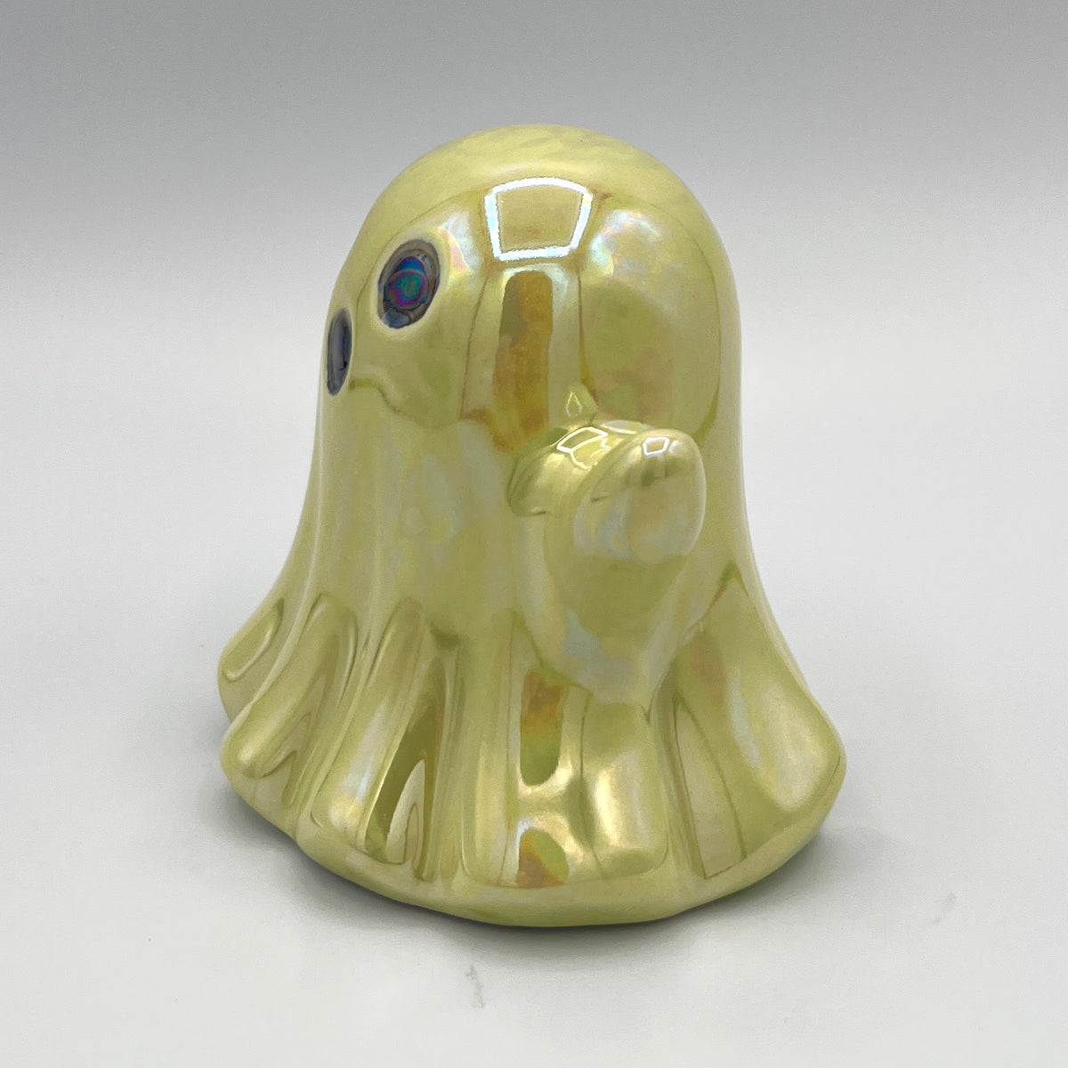 Lime green ghost figurine side view