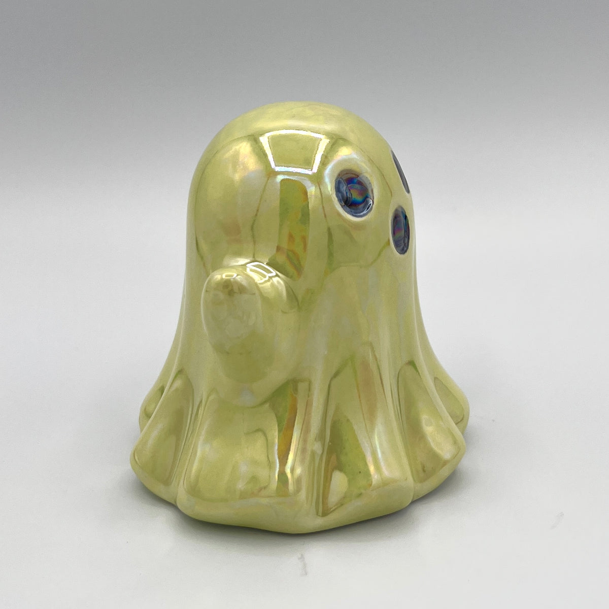 Lime green ghost figurine front view
