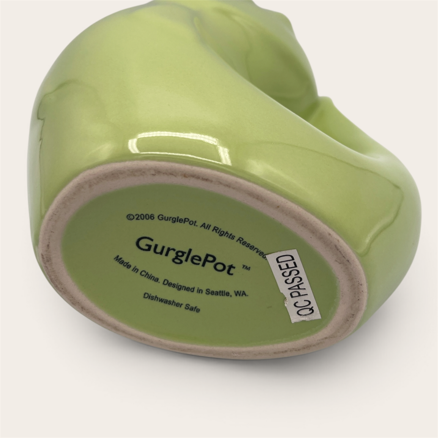GurglePot olive green fish pitcher – bottom showing brand stamp