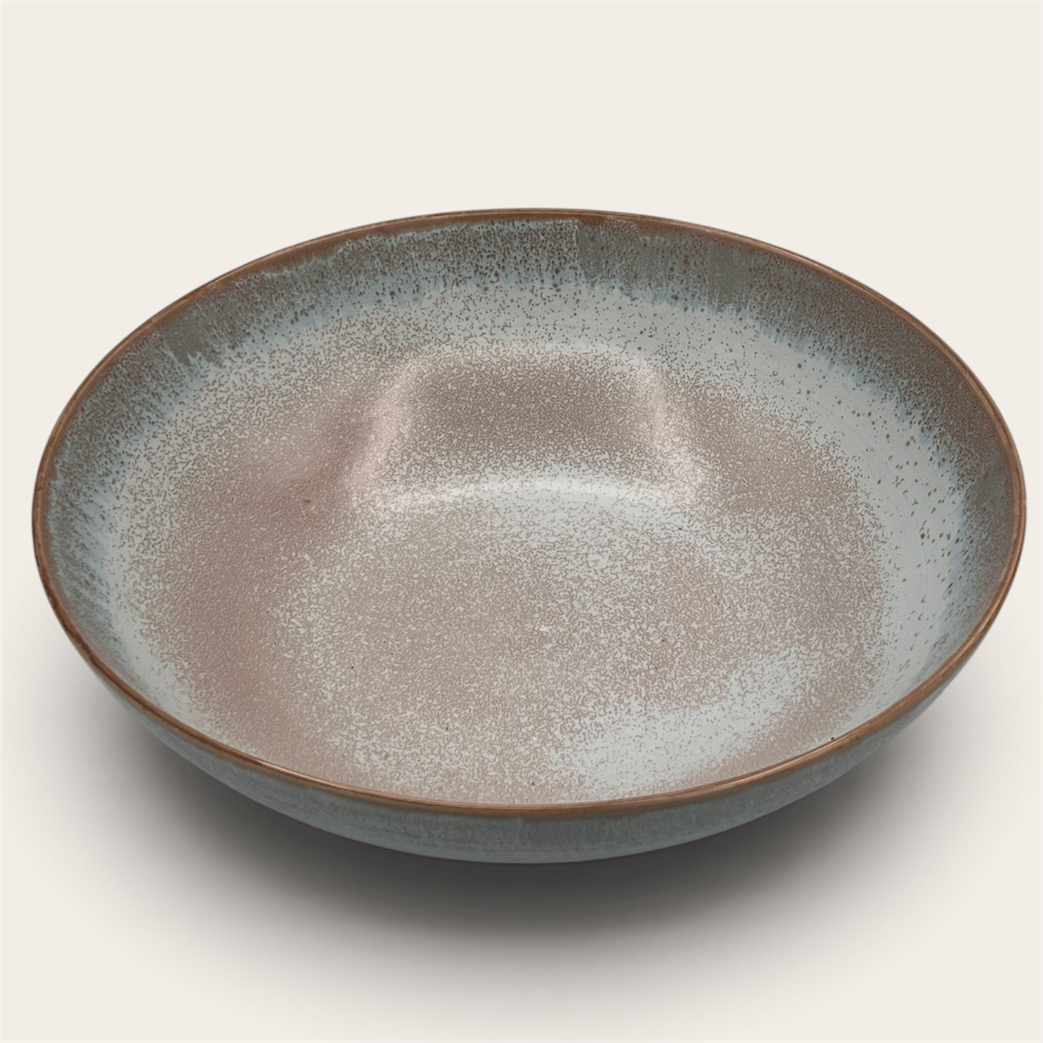 Reactive glaze stoneware serving bowl, angled view showing interior